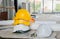 Yellow helmet on top white helmet in constructing site