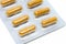 Yellow herb pills transparent gelatin capsule in blister pack