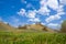 Yellow hills under blue sky with clouds