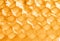 Yellow honeycomb with honey closeup