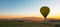 Yellow hot air balloon. Ballooning activity in Cappadocia at sunrise