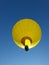 Yellow hot air balloon and clear blue sky