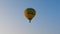 Yellow hot air balloon taking off at Fragneto Monforte