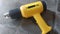 yellow hot gun, a tool for attaching stickers or decals