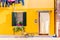 Yellow house with flowers and plants. Colorful houses in Burano island near Venice, Italy