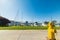 Yellow hydrant on a walk path in Oceanside