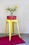 Yellow industrial stool and red rug