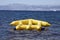 Yellow inflatable in ocean