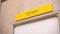 Yellow info plate with words Musical hall and braille script
