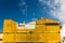 Yellow insulating material on building in Granada, Spain