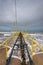 Yellow jetty and Baltic Sea on a cloudy day.