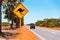 Yellow kangaroo sign on blue sky background