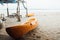 Yellow kayak on sandy beach sea. Two kayaks in sand on background sea.