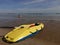 Yellow kayak on the shore