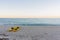 Yellow kayaks on a sandy beach