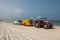 Yellow kayaks in tractor`s trailer on the beach of Caesarea, Israel