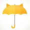 Yellow kids umbrella with cat ears on a white background