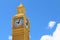 Yellow layout of Big Ben tower on blue sky background