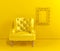 Yellow leather armchair, yellow carved frame for a picture or photo on the yellow wall, front view. Creative minimalistic interior