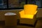 Yellow leather sofa and side wooden table