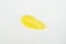Yellow lemon face or body exfoliating scrub texture. Beauty mask smear on white background. Cosmetic product swatch macro