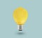 Yellow Lemon light bulb on bright blue background. Summer fun concept