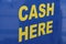 Yellow lettering large letters in English `Cash Here`