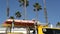 Yellow lifeguard car, ocean beach California USA. Rescue pick up truck, lifesavers vehicle.