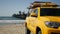 Yellow lifeguard car, ocean beach California USA. Rescue pick up truck, lifesavers vehicle.