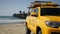 Yellow lifeguard car, ocean beach California USA. Rescue pick up truck, lifesavers vehicle.