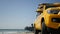 Yellow lifeguard car, ocean beach California USA. Rescue pick up truck, lifesavers vehicle.