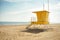 Yellow lifeguard post on an empty beach