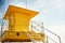 Yellow lifeguard post on an empty beach