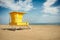 Yellow lifeguard post on an empty beach