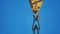 Yellow lifting crane hook blue a lifestyle sky background. crane hook construction concept