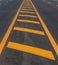 Yellow line symbol on a new paved road