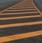 Yellow line symbol on a new paved road