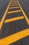 Yellow line symbol on a new paved road