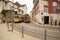 Yellow Lisbon trams in street in Portugal