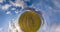 yellow little planet transformation with curvature of space among fields in evening day and beautiful clouds at sunset