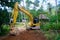 Yellow loader mashine digging the road