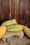 Yellow long zucchini on a wooden background