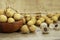 Yellow longan fruit served on wooden bowl with burlap background