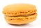 Yellow macaron on white background