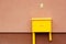 Yellow mailbox for GAS with a pink wall, Gasification of a turnkey private house