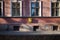 Yellow mailbox on wall of old historical building outdoor on the street