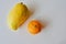 Yellow mango and orange mandarine