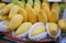 Yellow mangoes on a orange tray in the market Yellow mangoes in a orange tray