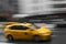 Yellow Manhattan Taxi motion blur speed