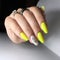 Yellow manicure on the nails. Yellow nail design on the fingers